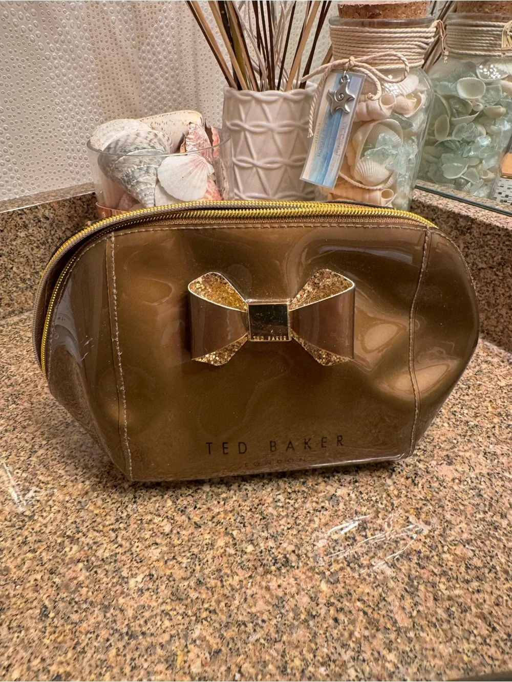 Ted Baker Brown Glossy Bronze Cosmetic Pouch with Glitter Bow Accent